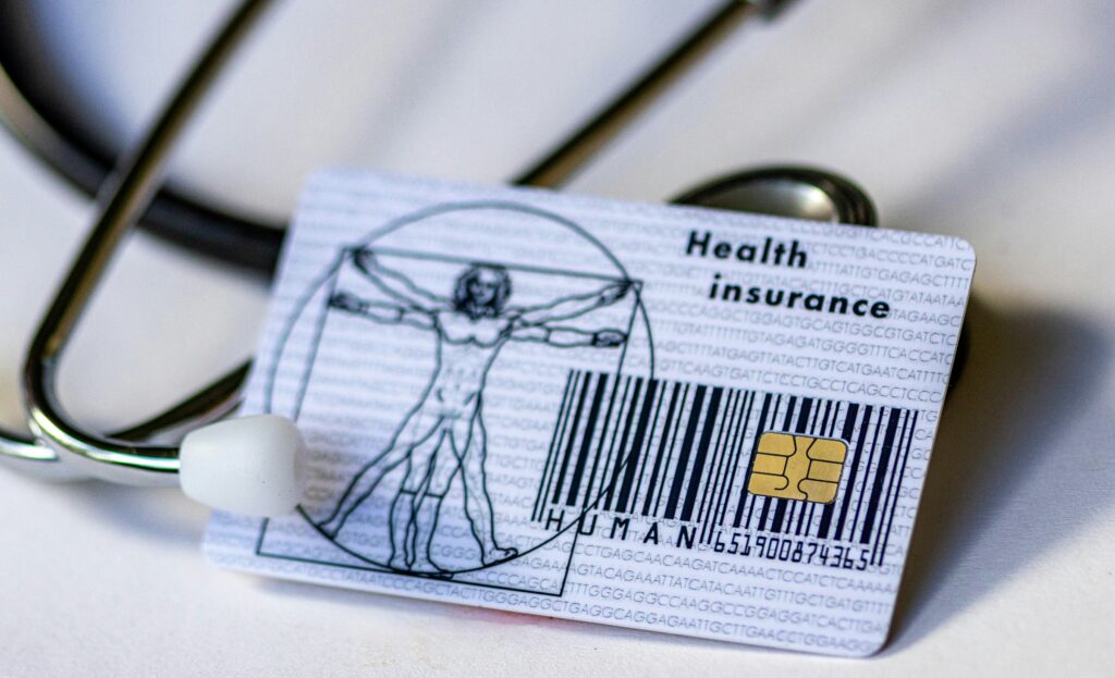 Health insurance card with a stethoscope around it